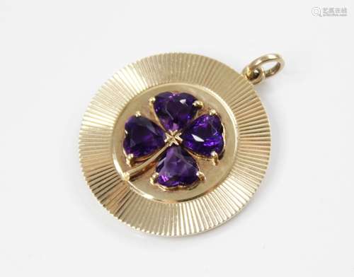 A 14ct gold amethyst 'lucky' clover pendant, the central rai...