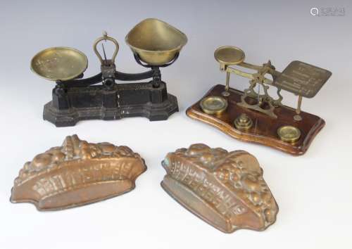 A set of brass postal scales, 20th century, the balance bar ...