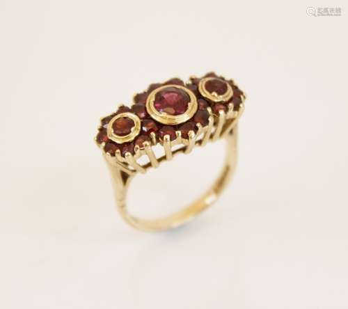 A 9ct gold garnet cluster ring, comprising three principle r...