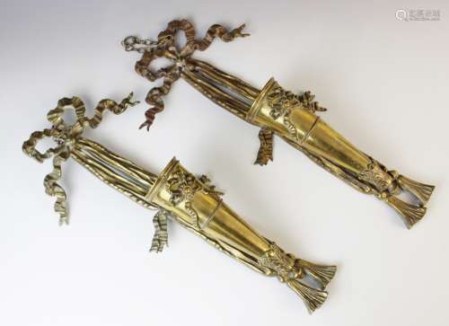 A pair of gilt brass torchere wall sconces, each of conical ...