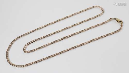 A 9ct gold curb link chain, lobster claw and loop fastening,...