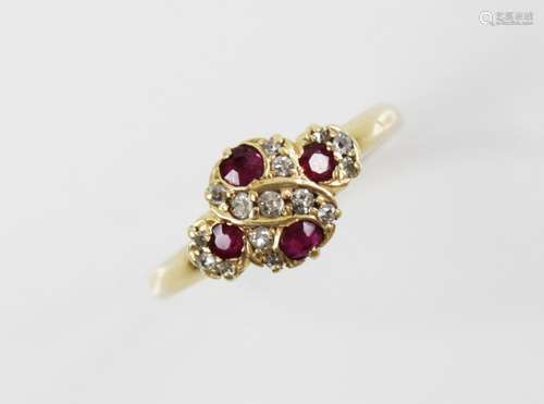 An Edwardian ruby and diamond 18ct gold ring, the quatrefoil...