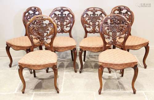 A set of six Victorian walnut balloon back dining chairs, th...