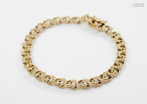 A 14ct gold curb link bracelet, tongue and box snap clasp fa...