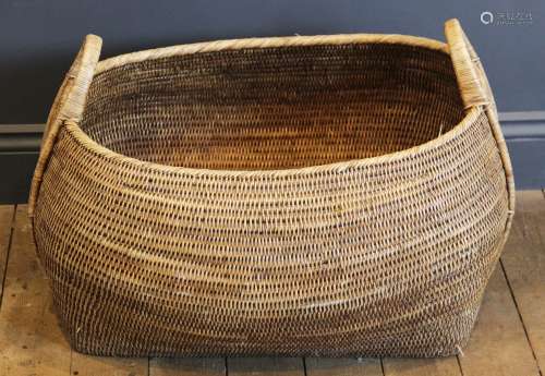 A wicker basket of large proportions, of swelling lozenge fo...