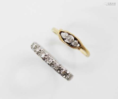 An 18ct gold diamond half-eternity ring, comprising nine rou...