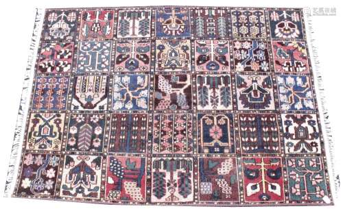 A multi-coloured ground full pile old Persian Bokhara carpet...