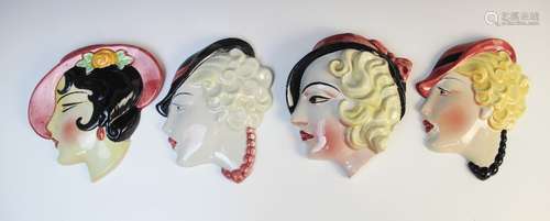 Four Art Deco wall masks by Cope & Co, each modelled as a yo...