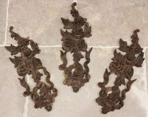 Three carved wooden architectural panels modelled as garland...