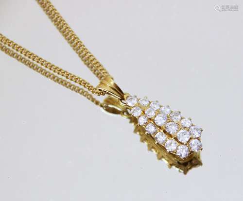 A diamond teardrop pendant, comprising eighteen round brilli...