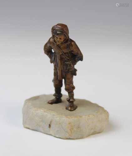 An Austrian patinated bronze figure of a winter boy, circa 1...