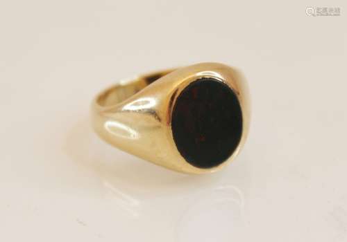 A 9ct bloodstone signet ring, the central oval bloodstone pa...