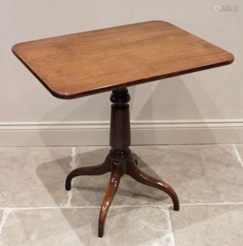 An early 19th century mahogany tripod table, the rectangular...