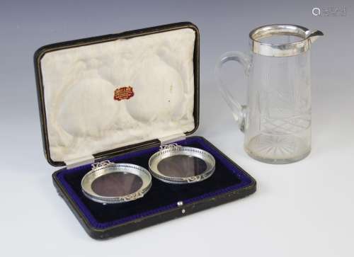 A George V cut glass silver mounted jug, John Grinsell & Son...