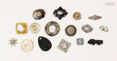 A selection of Victorian and later brooches, to include a si...