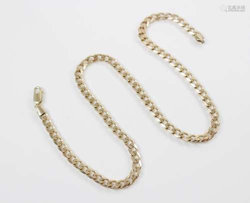 A 9ct gold curb-link chain, with lobster claw and loop faste...