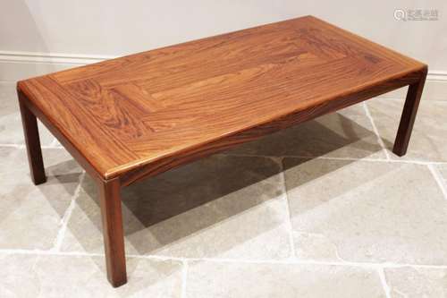 A mid century rosewood coffee table, probably Indian rosewoo...