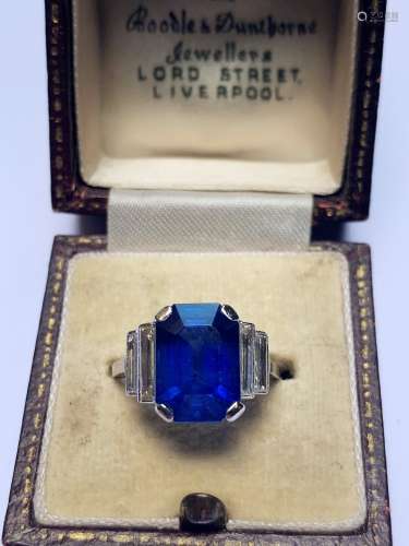 An Art Deco sapphire and diamond ring, the central octagonal...