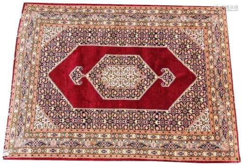 A Persian pattern silk work rug, the central angular medalli...