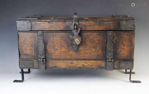 A 17th century style stained oak and iron carriage safe box,...