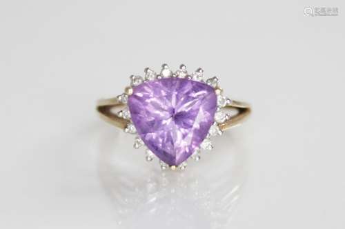 An amethyst and diamond 9ct gold cluster ring, the central t...