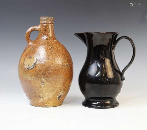 A black glazed Jackfield type water jug, late 18th century, ...