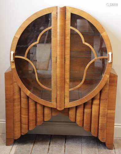 An Art Deco walnut display cabinet by S. Spanglett Ltd, of g...