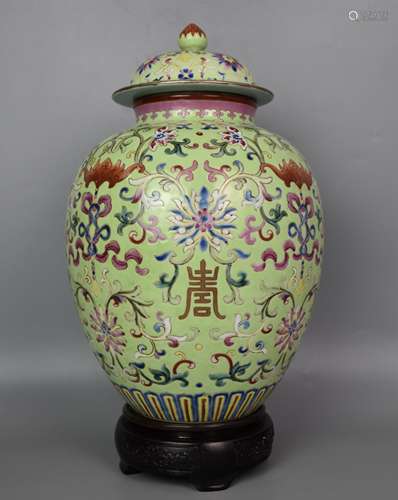 A CHINESE GREEN-GROUND FAMILLE ROSE INTERLOCKING LOTUS JAR A...