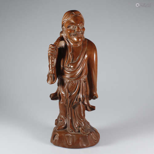 A CHINESE WOODEN CARVED DEITY