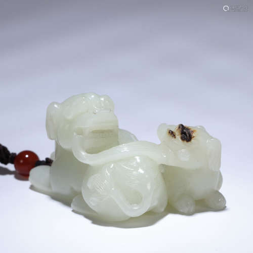 A CHINESE WHITE JADE CARVED DECORATION WITH TWO LIONS