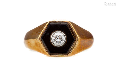 A BLACK HARDSTONE AND DIAMOND RING