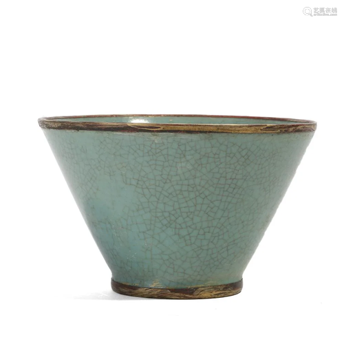 A CELADON-GLAZED CUP