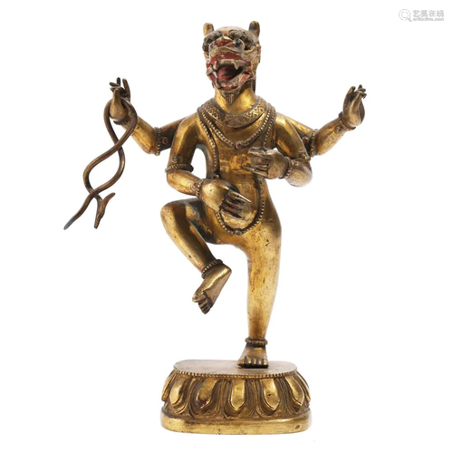 A GILT BRONZE FIGURE OF A GUARDIAN