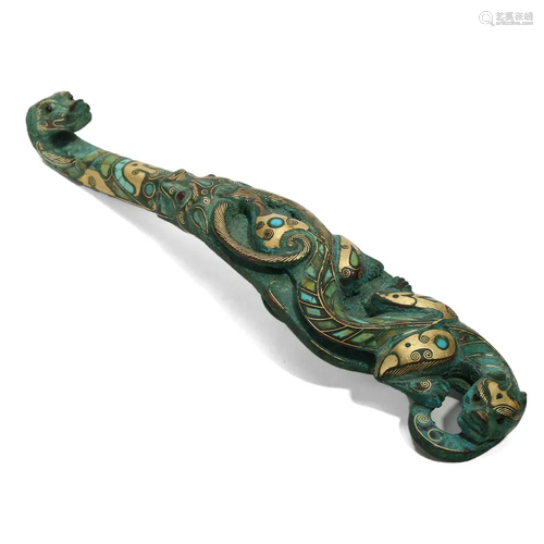 A GOLD-INLAID BRONZE 'BEAST' BELT HOOK