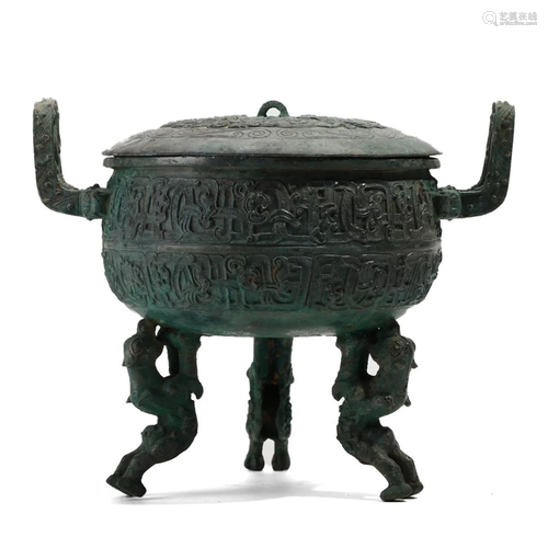 A BRONZE TRIPOD CENSER WITH HANDLES