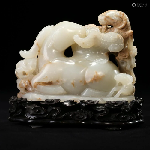 A CARVED CELADON JADE 'THREE RAMS' GROUP