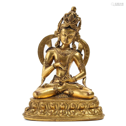 A GILT BRONZE FIGURE OF SEATED TARA