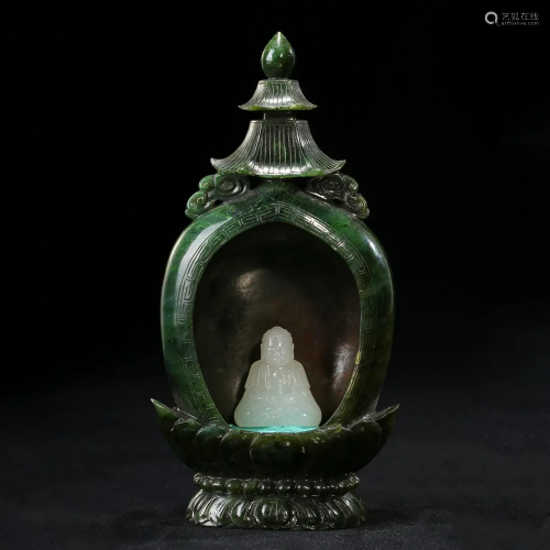 A CARVED WHITE JADE BUDDHA IN A SPINACH GREEN JADE