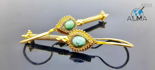 A pair of 14-16K Gold earrings inset with turquoise -
