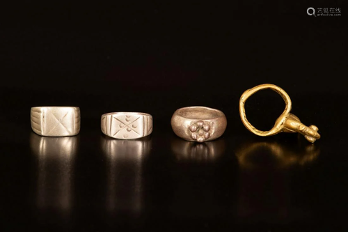 A lot of 4 silver and brass rings