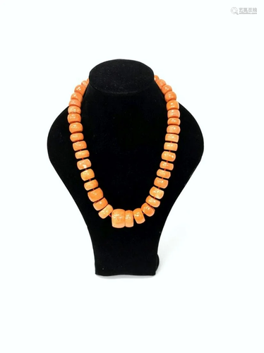 A coral necklace in gradient sizes