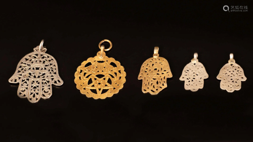 A lot of four silver Hamsa pendants and an amulet -