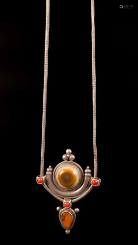 A silver Agate, amber and coral pendant - Nepal, 20th
