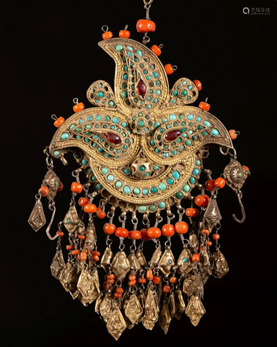 A gilt silver and coral paisley shaped shokila ornament