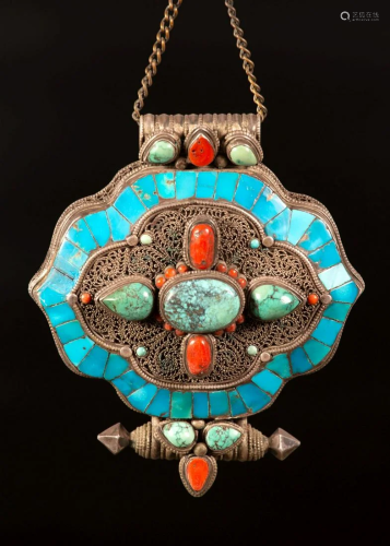A Silver amulet pendant inset with turquoise and Coral