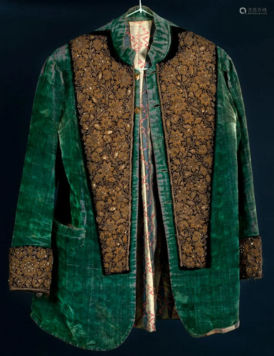 A green velvet jacket with silver embroidery and a