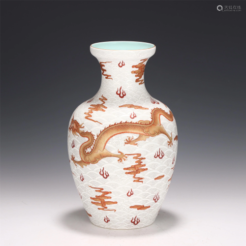 A CHINESE WHITE GLAZED IRON-RED DRAGON-CLOUD VASE