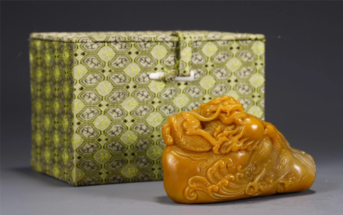 A CHINESE SOAPSTONE CARVED DRAGON DECORATION