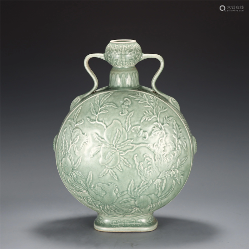 A CHINESE PEA GREEN GLAZED AND INCISED MOON FLASK