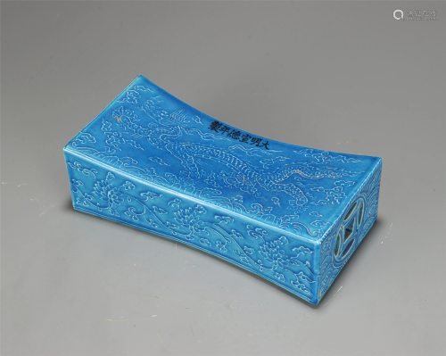 A CHINESE BLUE GLAZED INCISED DRAGON PORCELAIN PILLOW